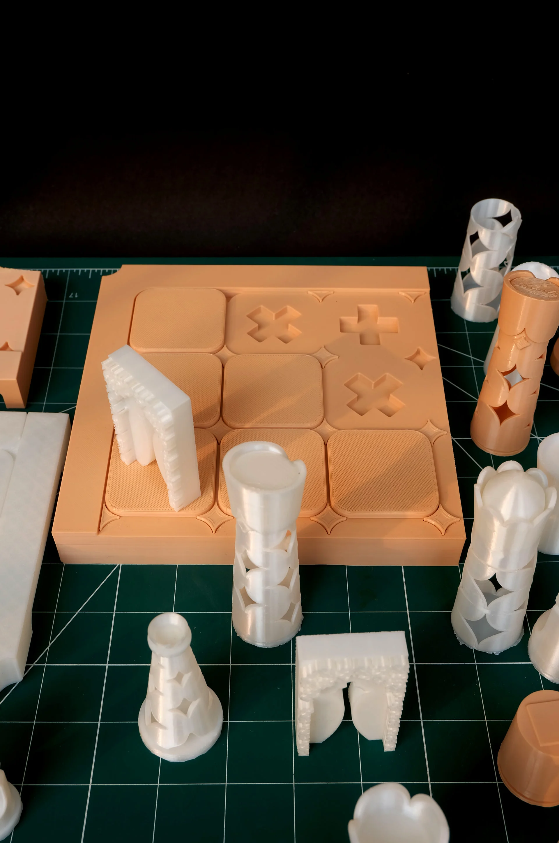 Printed board tiles and piece variations on the cutting mat